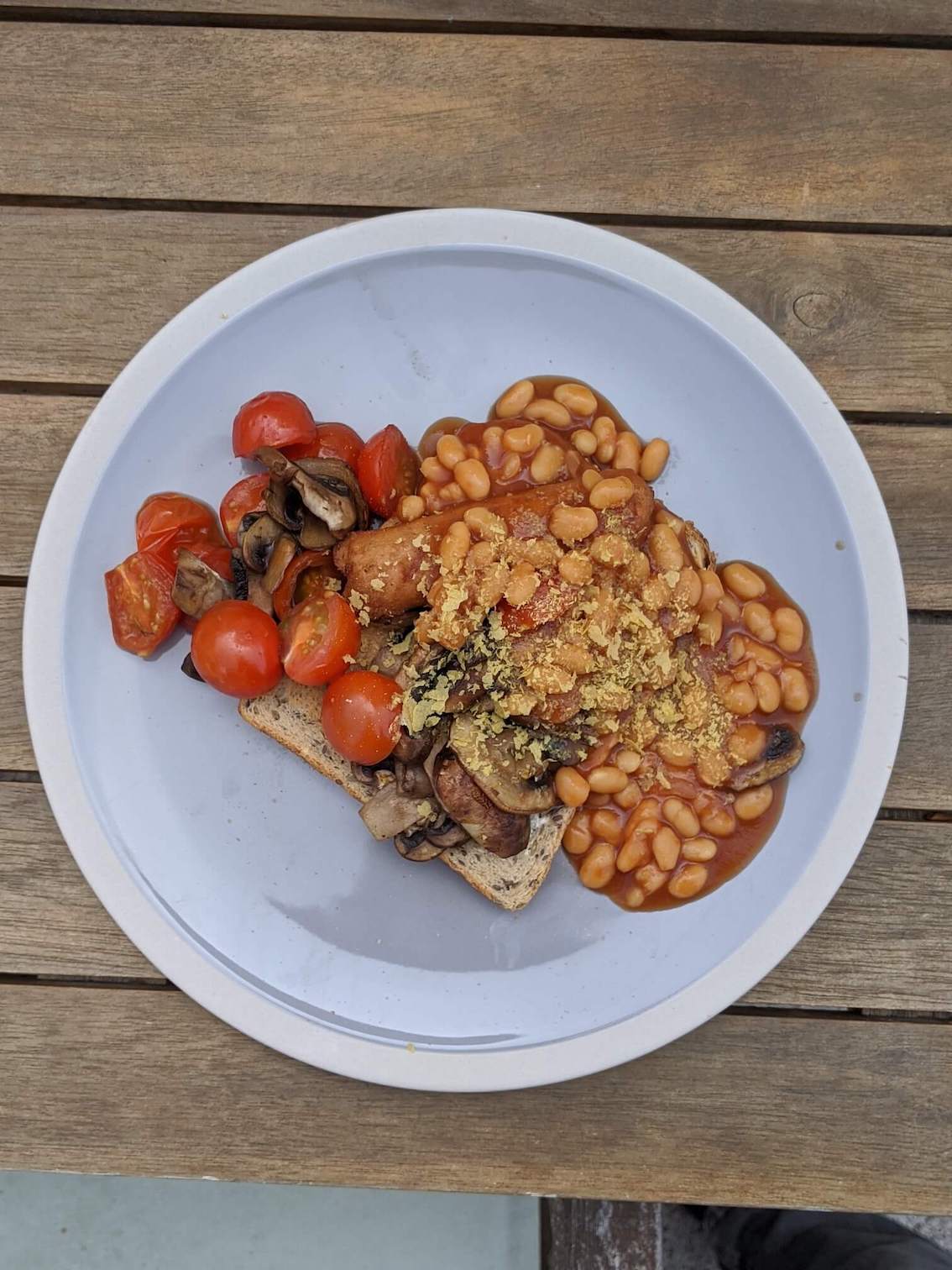 Beans, mushroom, sausage, tomatoes on toast