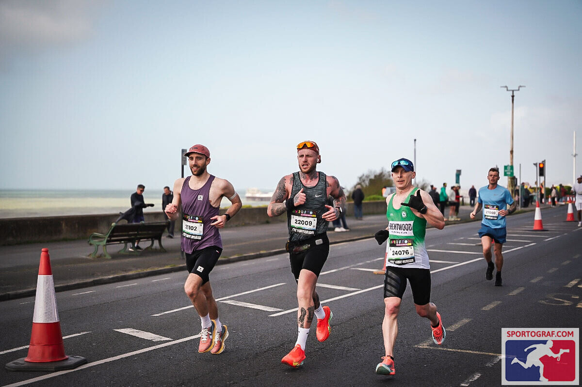 Me and 2 other runners running along Marine Parade towards the Marina, with the sea and the pier in the background