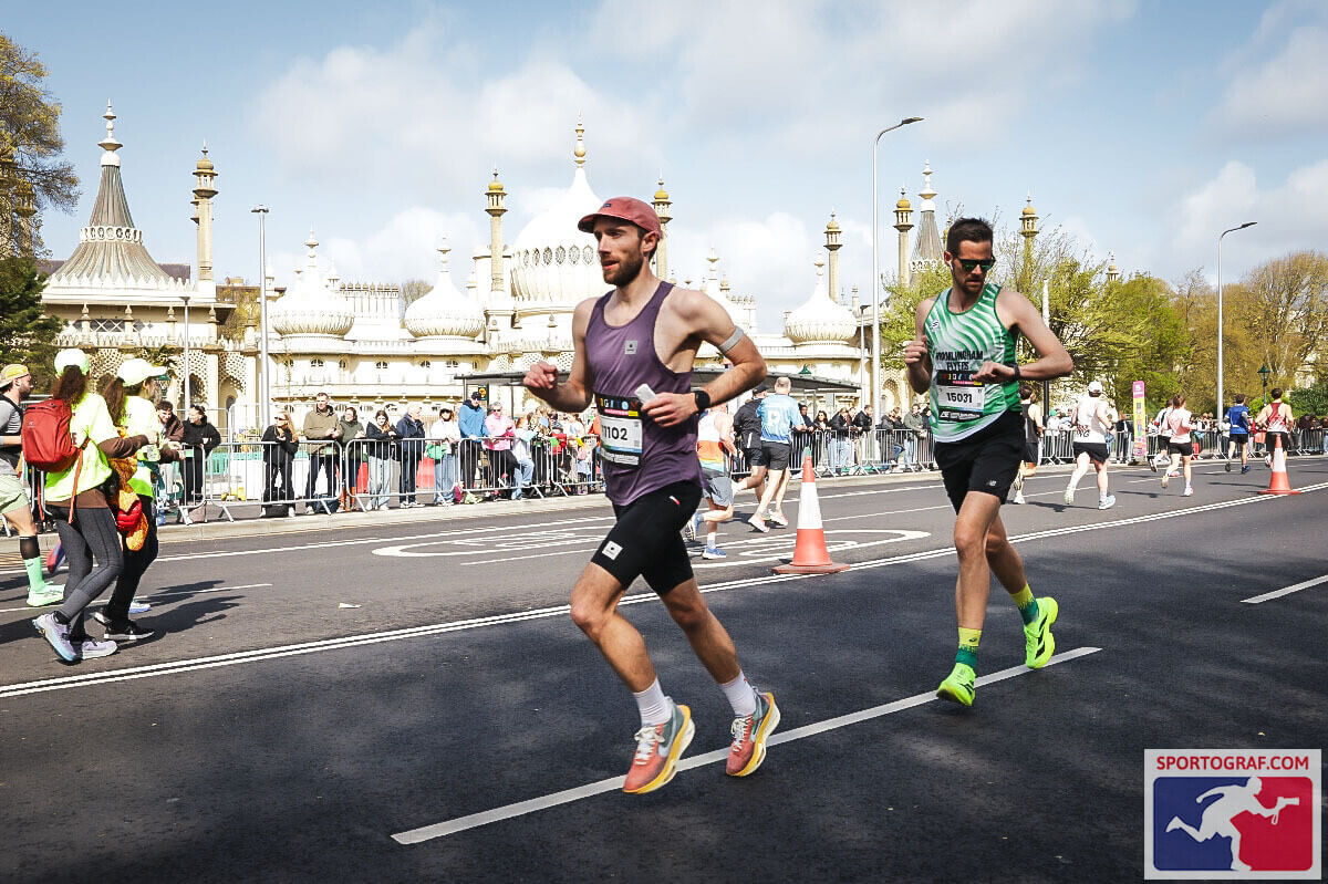 Me, with another runner, running in the foreground past Brighton Pavillion in the background