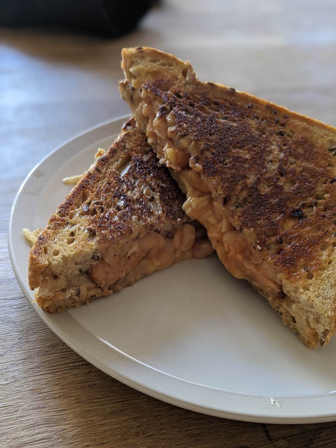 Cheese, bean and sausage toastie