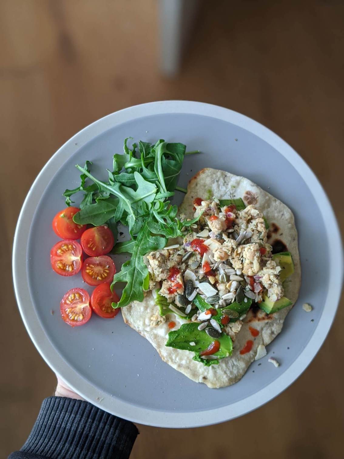 Chickpea tuna, avo, rocket, cherry tomato on a flatbread