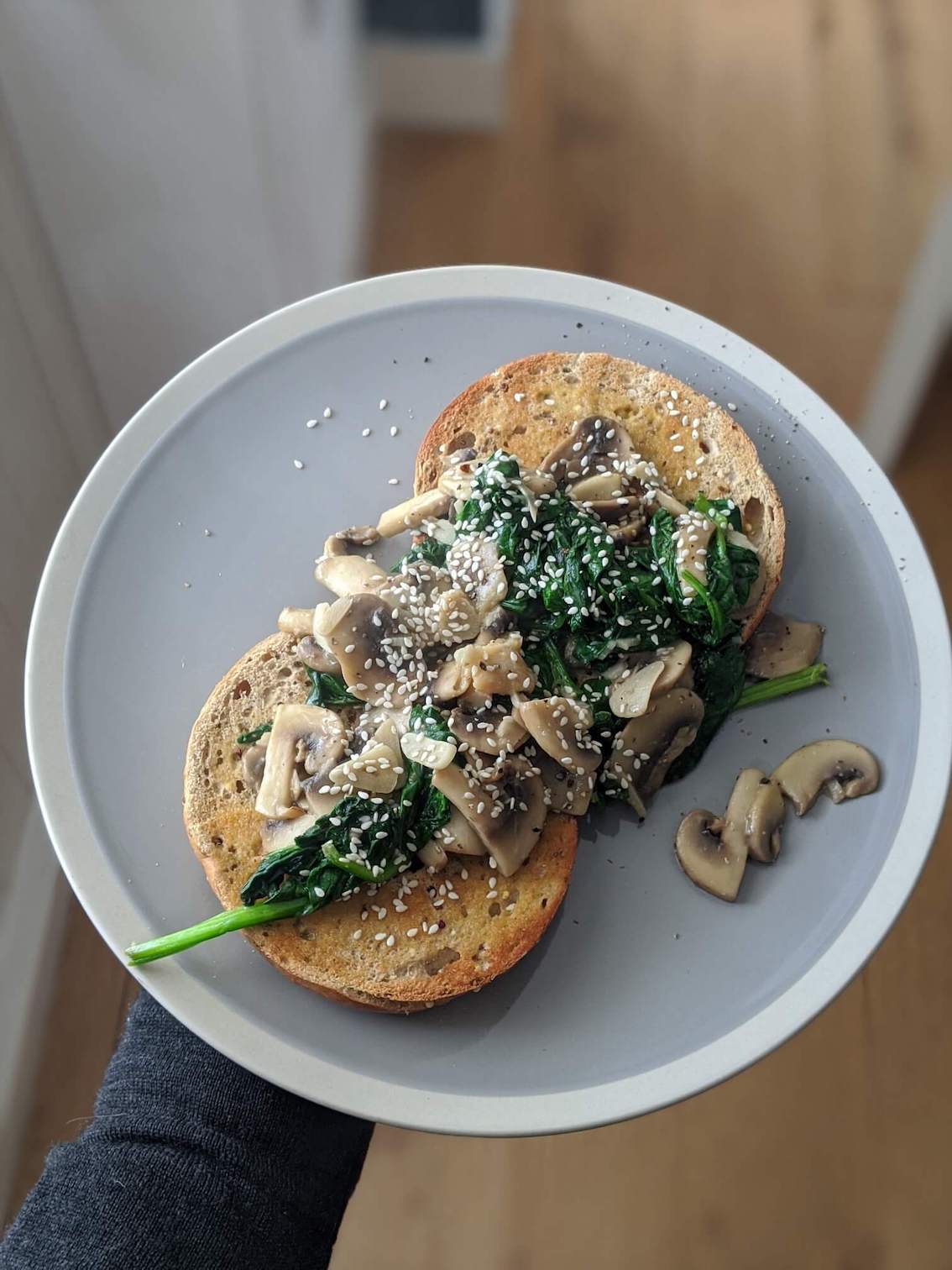 Miso, mushroom, coconut and spinach on a bagel