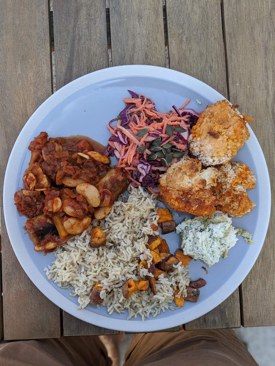 Sausage bean stew, brown rice, sweet potato, coleslaw, cauliflower wings