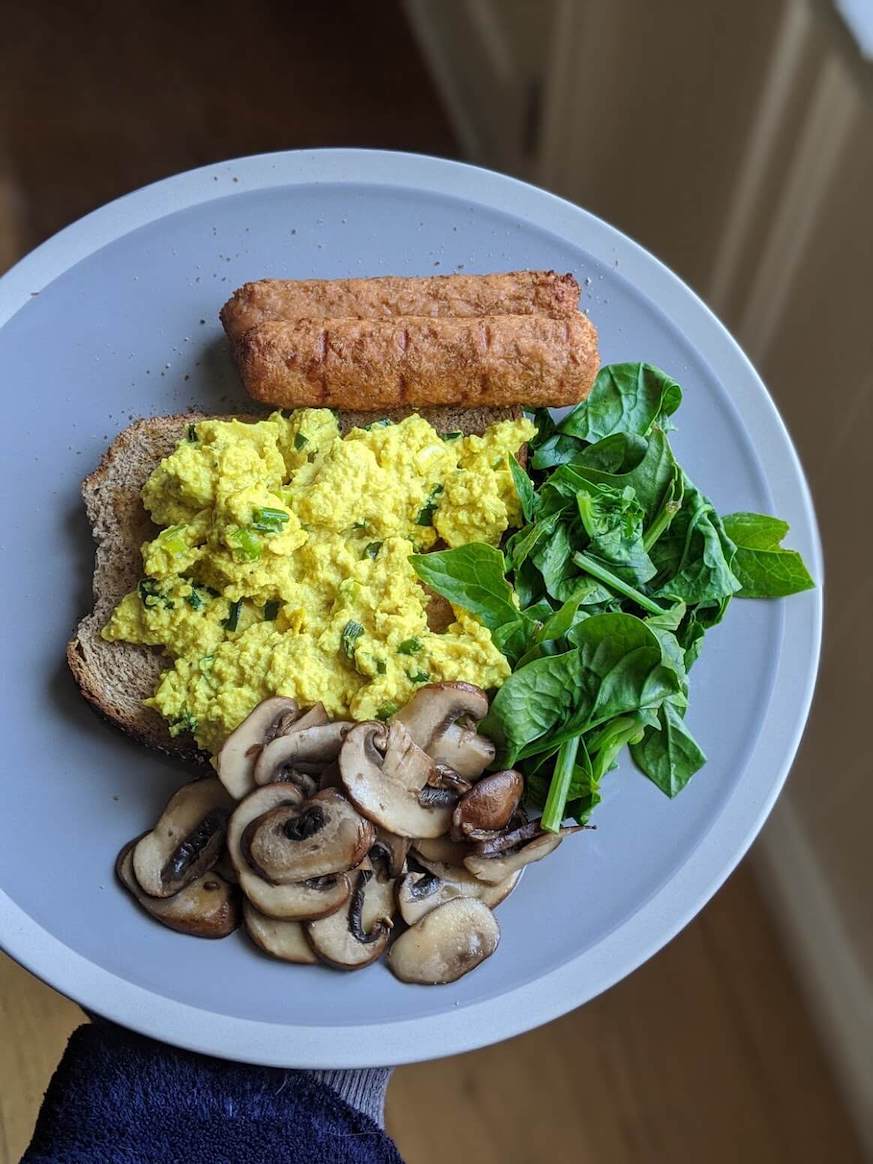 Scrambled Tofu, Linda McCartney sausages, mushrooms & spinach on toast